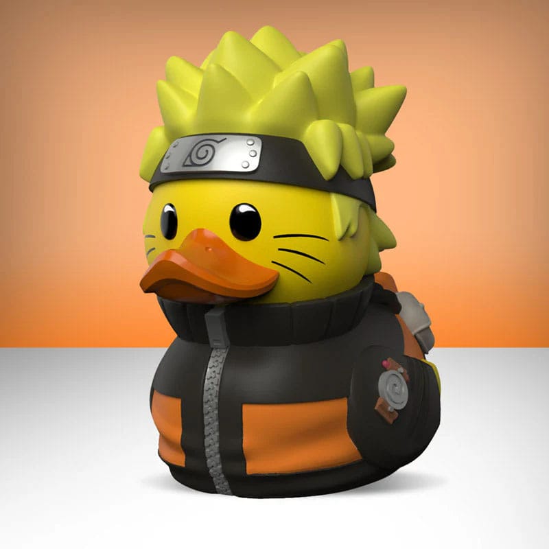 Figur einer Ente im Naruto-Uzumaki-Stil mit Stirnband und orange-schwarzer Jacke.