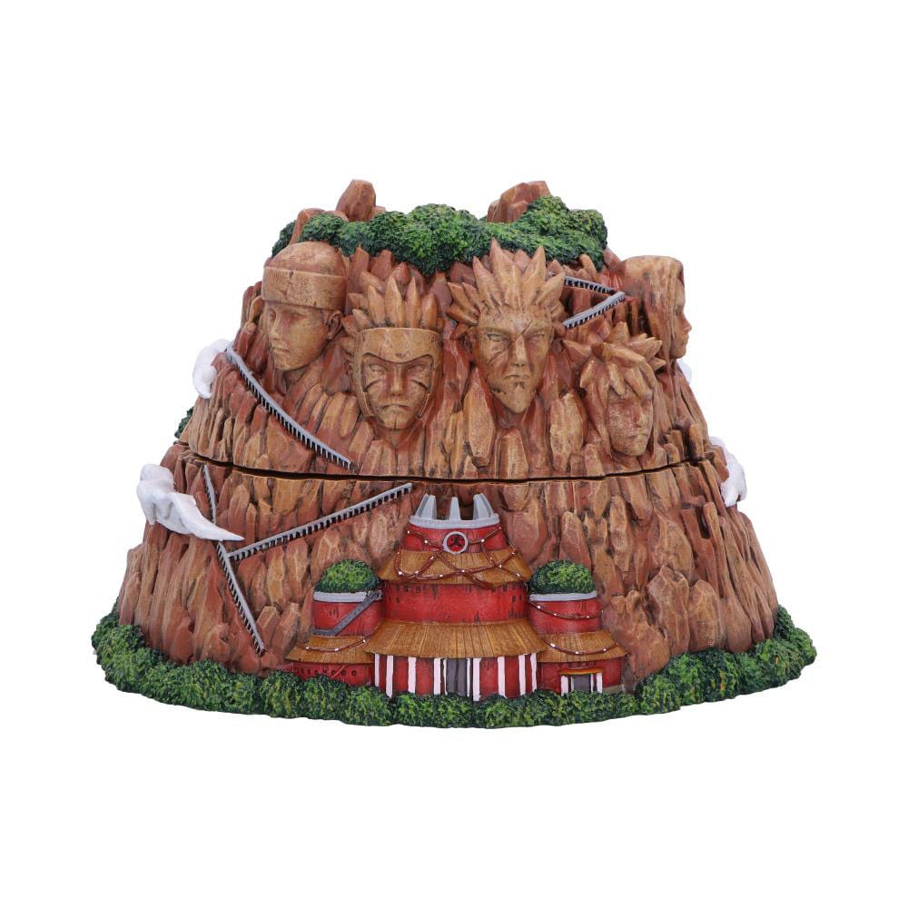 Zweiteilige Aufbewahrungsbox in Form des Hokage-Felsens aus Naruto mit den Gesichtern der Hokage und dem roten Verwaltungsgebäude vor weißem Hintergrund.