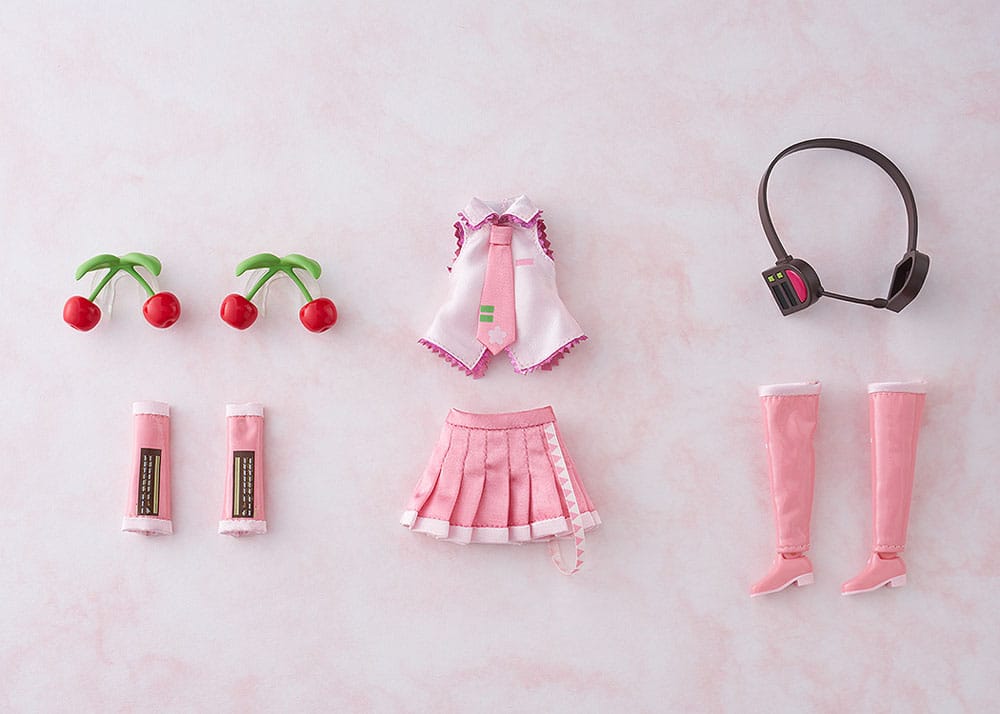 Good Smile Company Harmonia humming Puppe von Sakura Miku in rosa Stoffkleidung mit Kirschen-Haarschmuck.